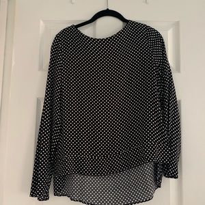 Philosophy Black and white polka dot top with open sides to the waist.